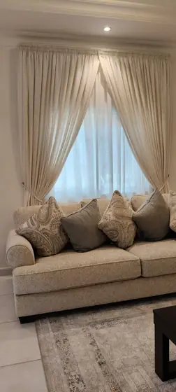 Swag curtains with tiebacks in a formal reception room