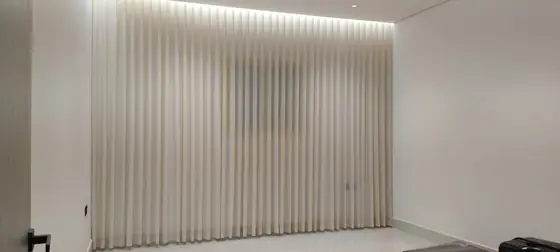 Floor-to-ceiling sheer curtains in a Riyadh majlis