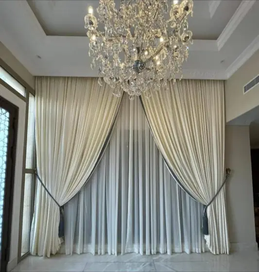 Custom curtains hung across a full living room wall