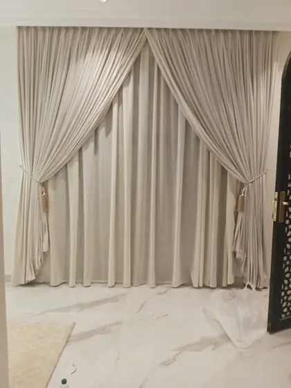 Tied-back curtains with a sheer under-layer