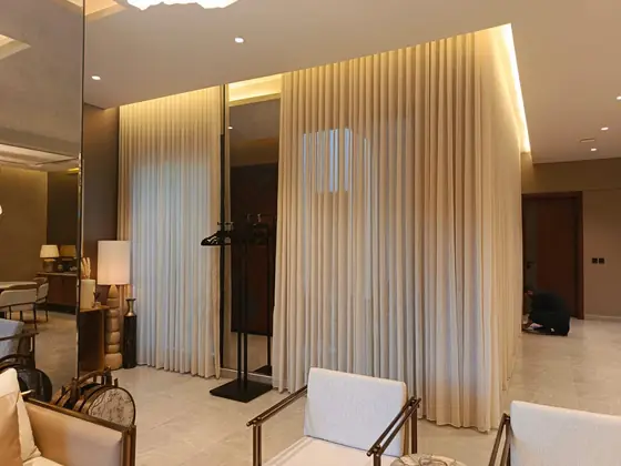 Floor-to-ceiling sheer curtains in a Riyadh majlis