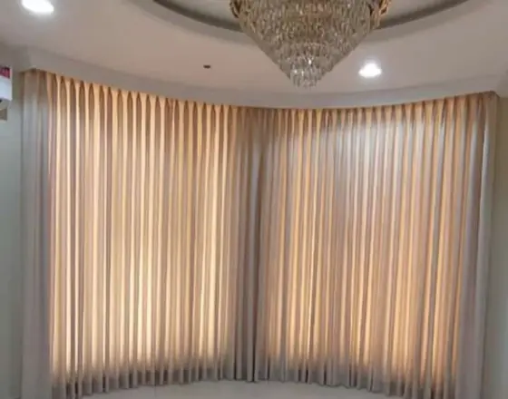 Floor-to-ceiling sheer curtains in a Riyadh majlis